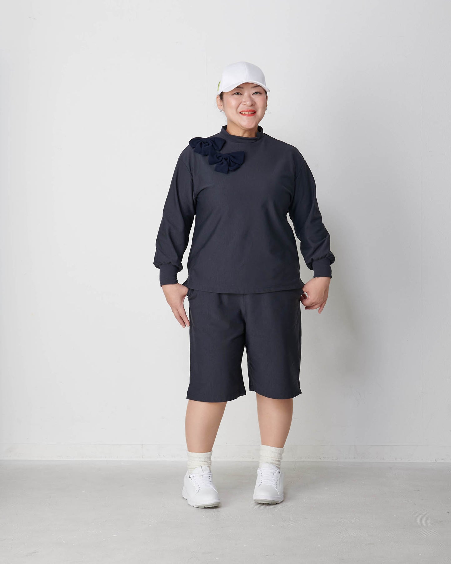 Moisture-wicking, heat-generating mock neck pullover with removable ribbon