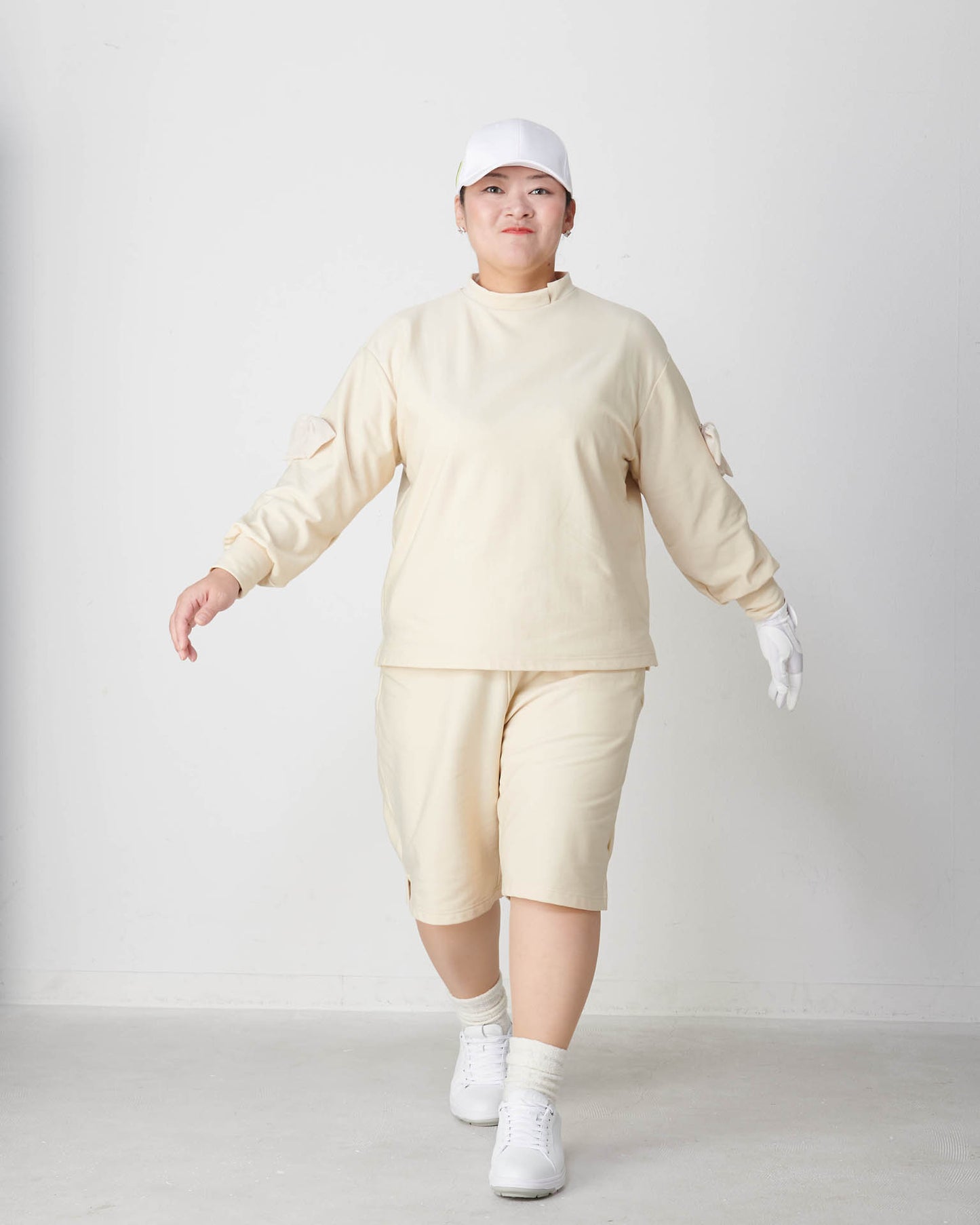 Moisture-wicking, heat-generating mock neck pullover with removable ribbon