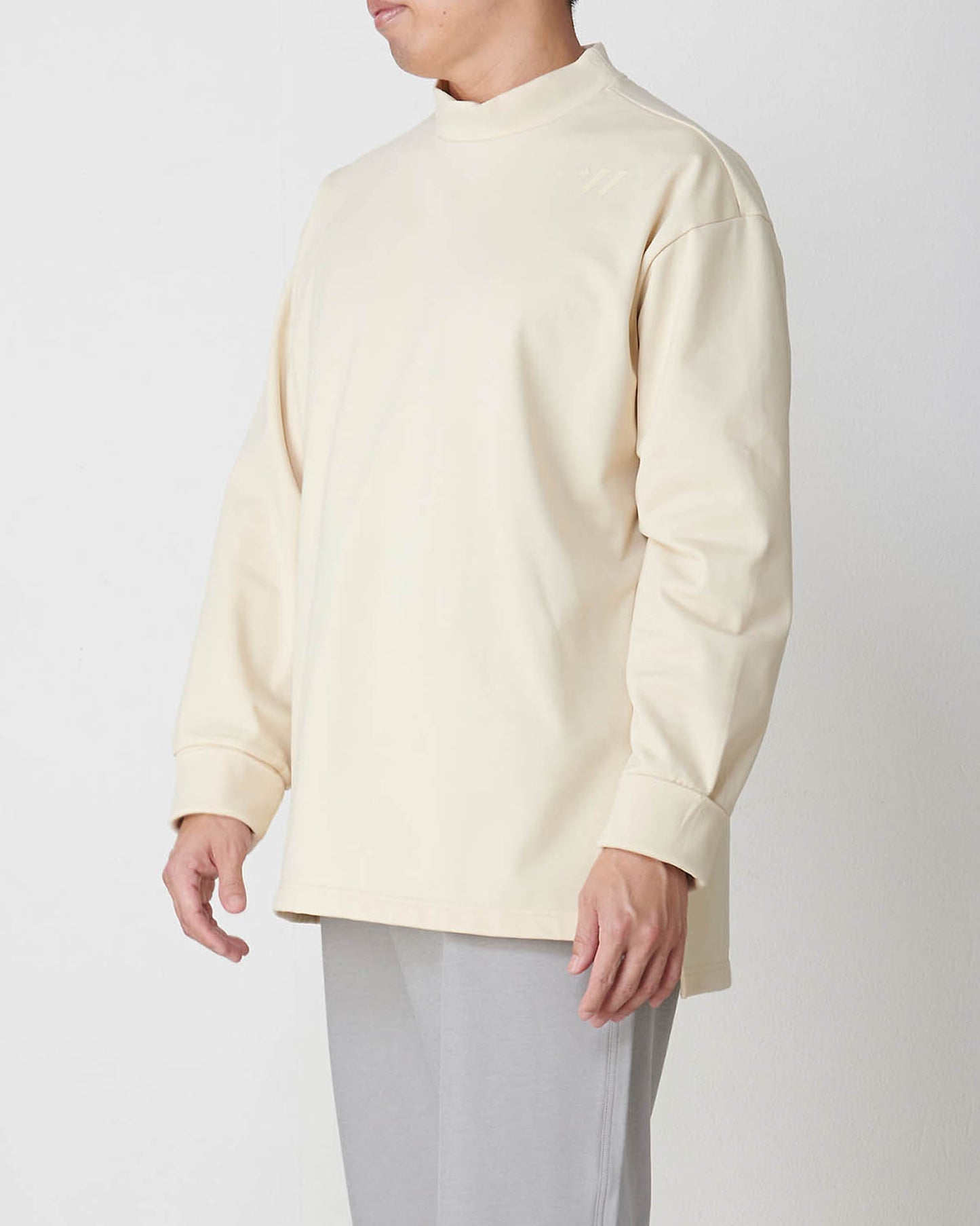 Moisture wicking and heat generating mock neck pullover